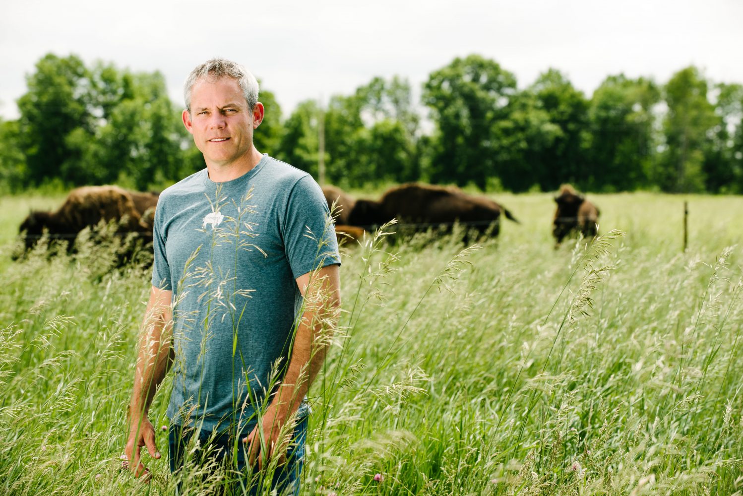 Sean Lenihan with bison pasture